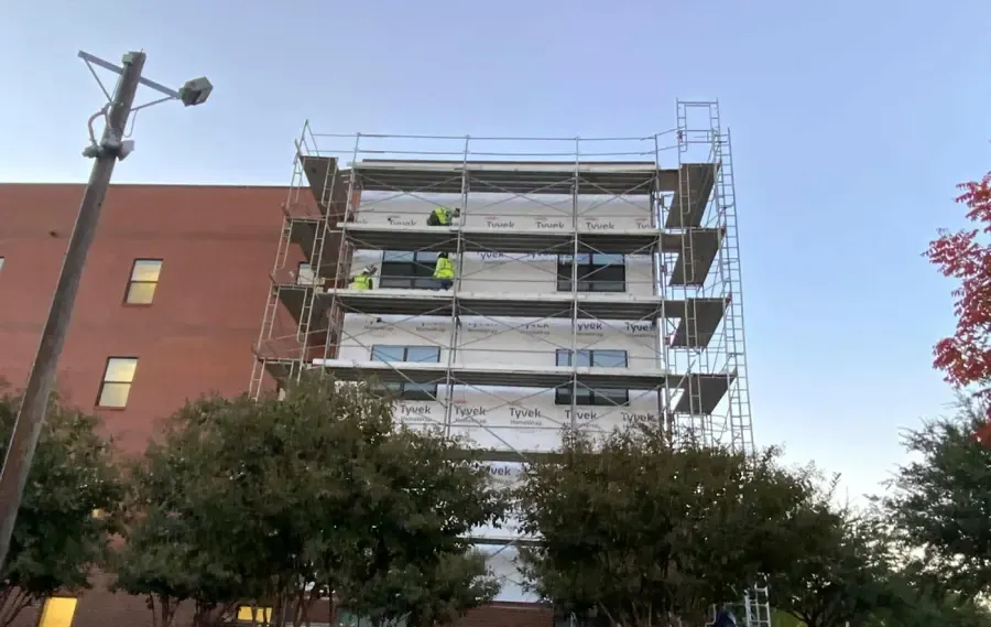 Building wrap during vapor barrier installation