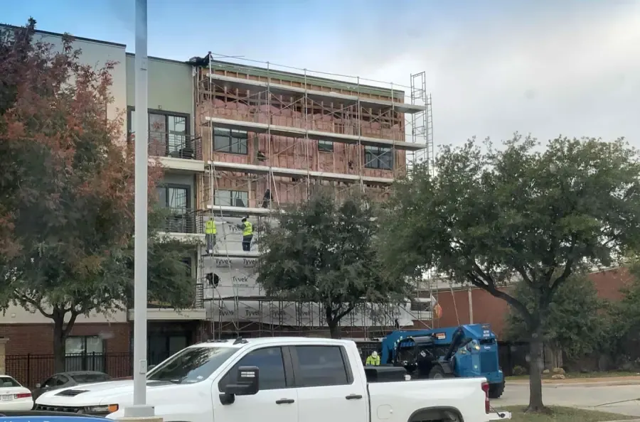 Exterior cladding removed around windows with water intrusion
