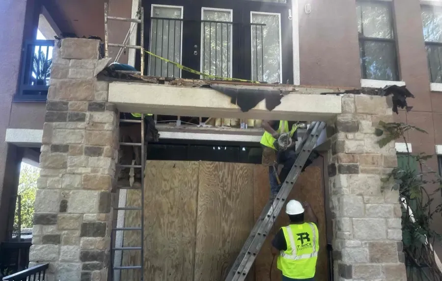 Cantilever balcony demolition during fire restoration